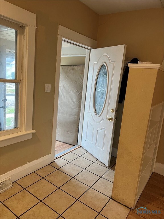 foyer off of closed front porch