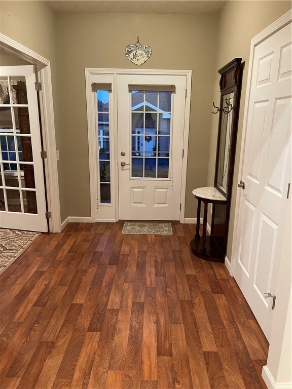 Entry Has Wood Floors and Storage Closet