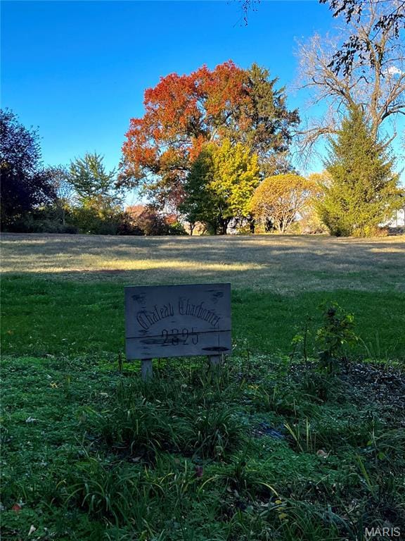 View of property's community featuring a lawn