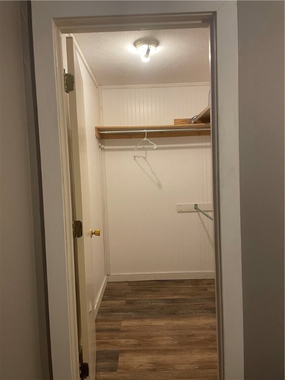 Walk in closet in primary bedroom