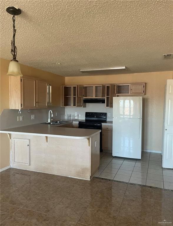 Kitchen featuring light tile flooring, white fridge, kitchen peninsula, decorative light fixtures, and ventilation hood