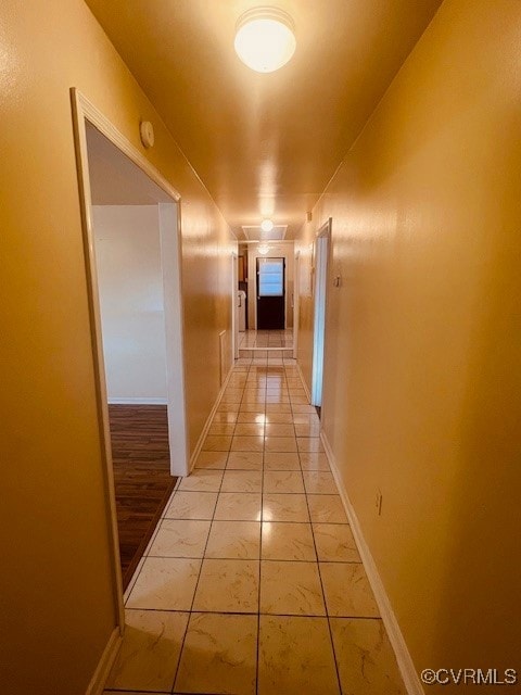 Corridor featuring baseboards