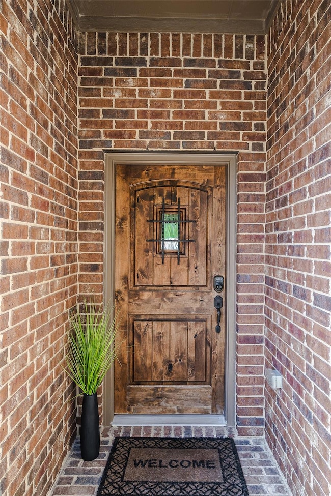 Property entrance with brick siding