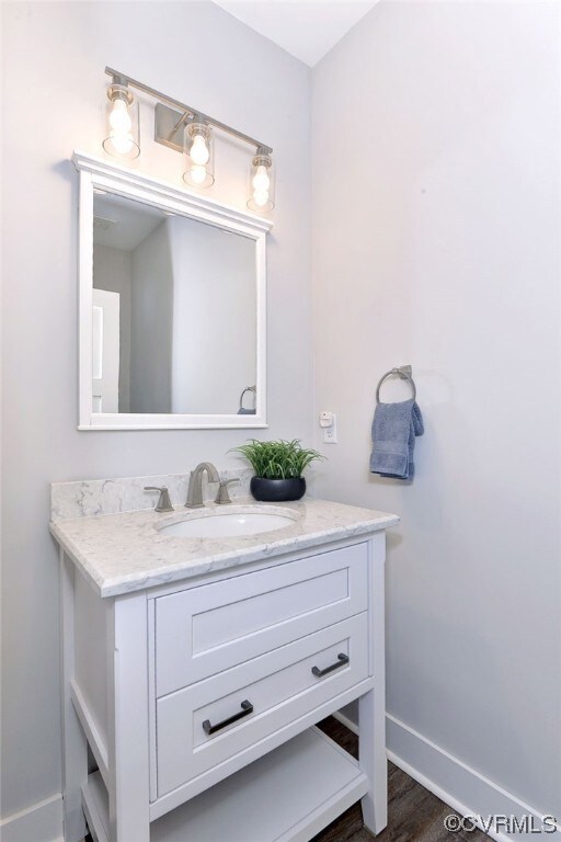 Powder Room with quartz top, LVP flooring, dual flush toilet, and hidden exhaust fans built into the light.  Solid core door and interior wall insulation for added privacy