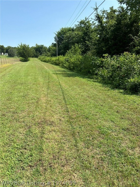 Side of property mowed area is the private road