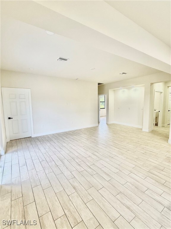 Unfurnished room featuring light wood-type floorin