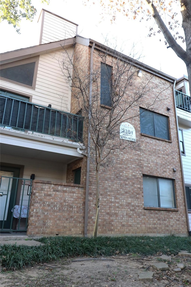 View of home's exterior featuring a balcony