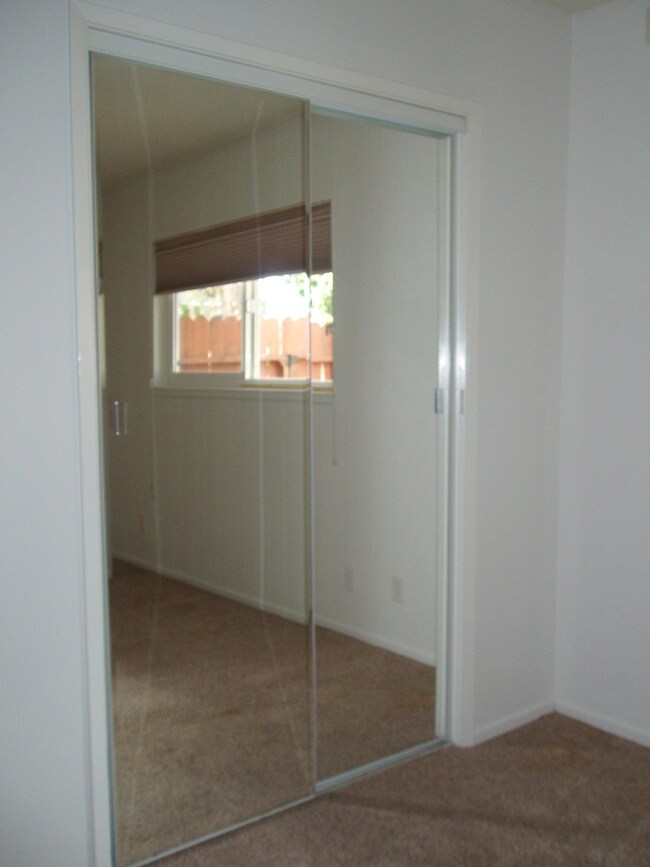 Mirrored closet in master bedroom