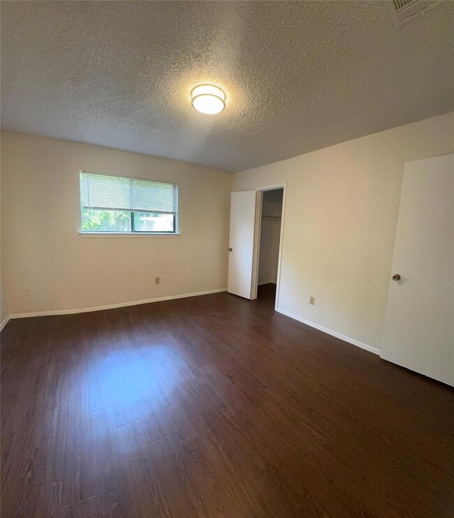 Spare room featuring baseboards, visible vents, a