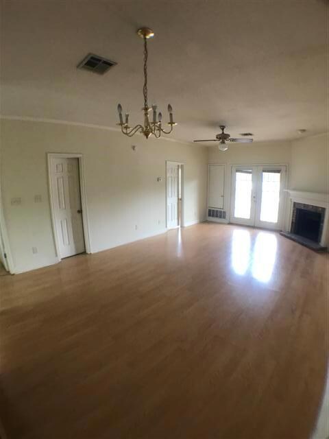 Unfurnished living room with wood finished floors
