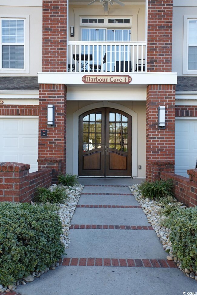 Entrance to property featuring french doors, a bal