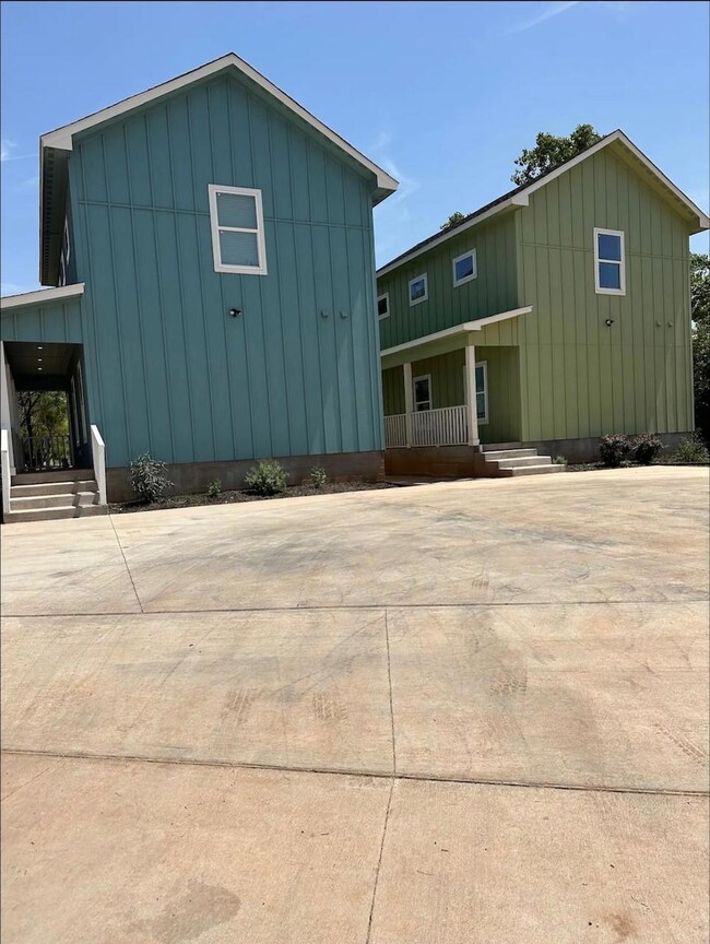 Exterior of both units-side view. Parking for both