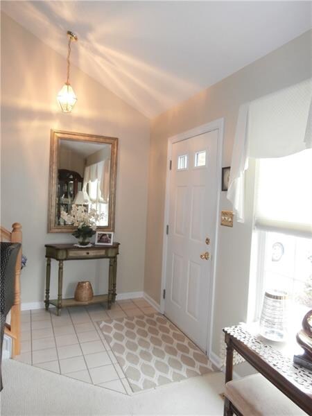 Ligth and bright entry with ceramic tile floor
