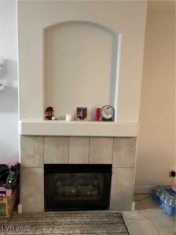 Room details featuring a tile fireplace