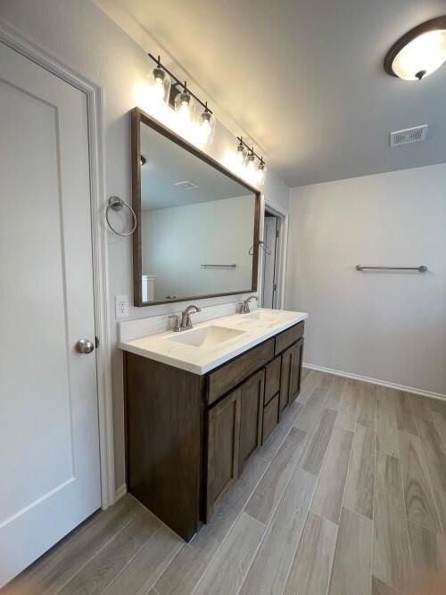 Bathroom featuring hardwood / wood-style floors an