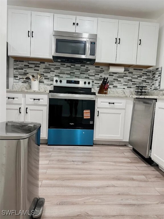 Kitchen with appliances with stainless steel finis
