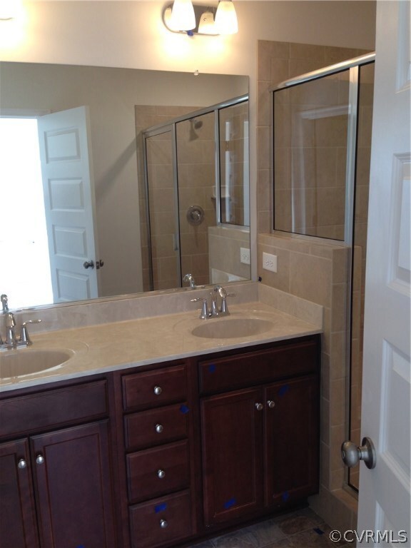 Owner's Bathroom with ceramic shower and double bo