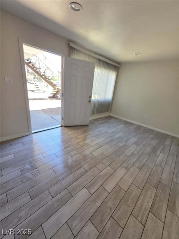 Unfurnished room featuring plenty of natural light
