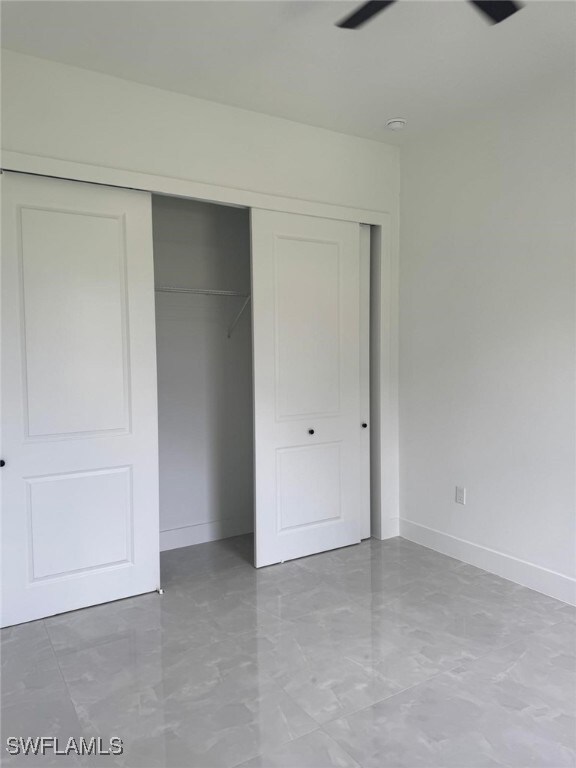 Unfurnished bedroom featuring a closet and light m