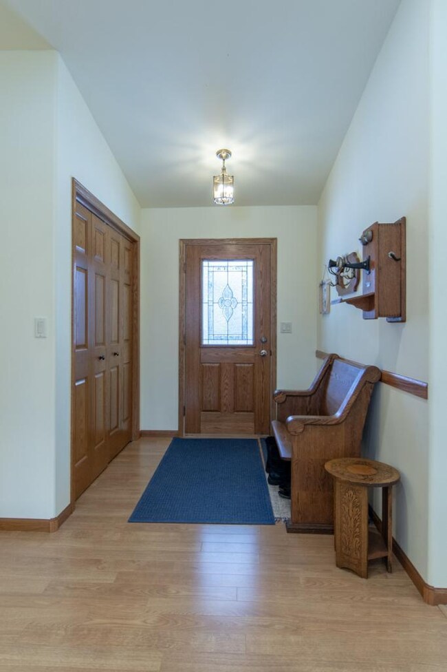 Spacious entryway with coat closet.