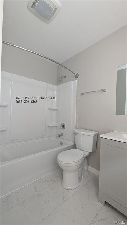 Full bathroom with bathtub / shower combination, vanity, and light marble finish flooring