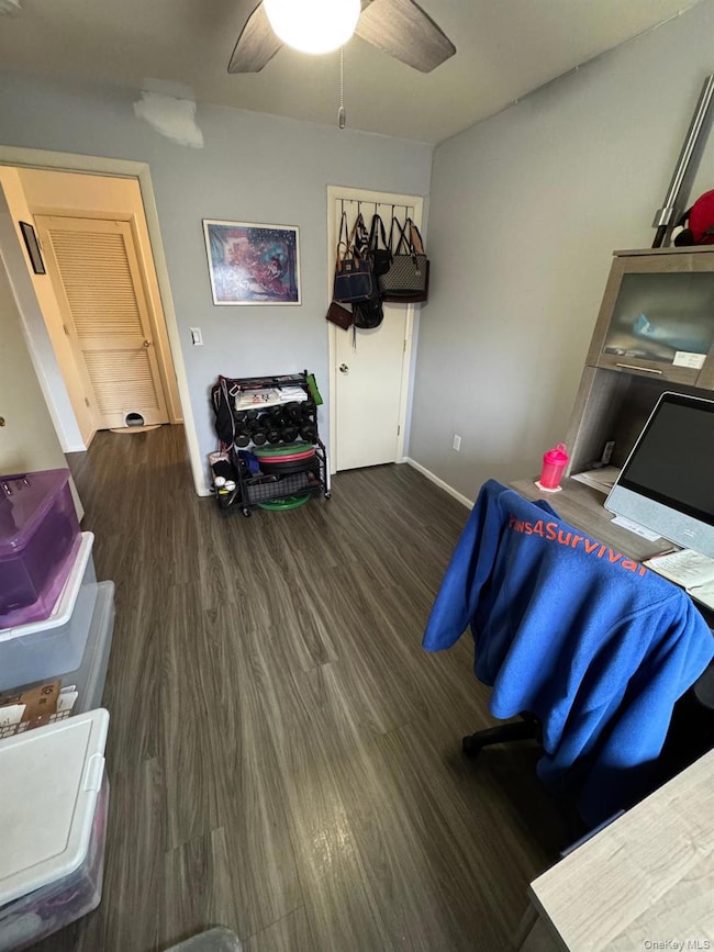 Bedroom with wood finished floors and a ceiling fan