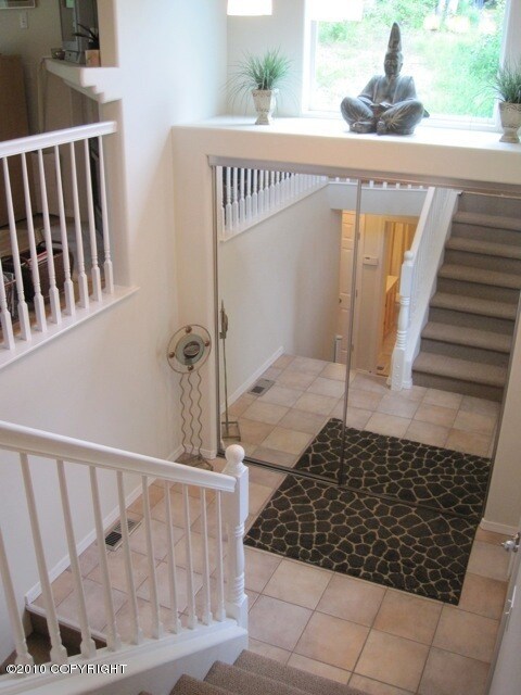 Tile Entry with mirrored closet doors