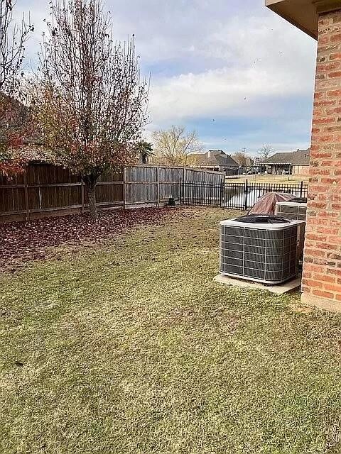 View of yard featuring central AC unit