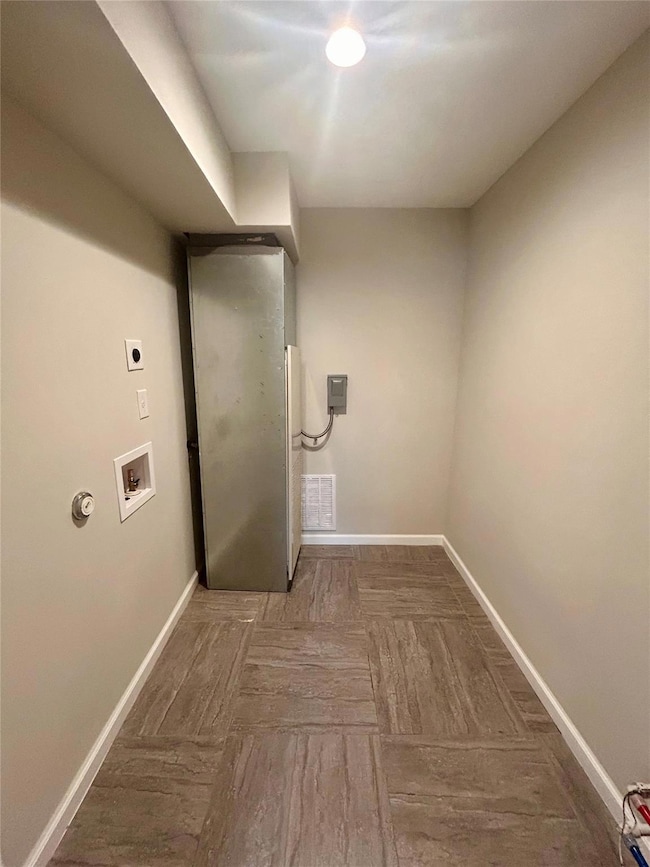 Laundry room with electric dryer hookup and washe