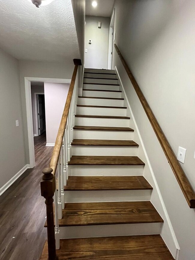 VIEW OF STAIRS FROM FOYER