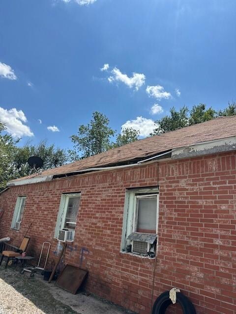 View of home's exterior featuring cooling unit