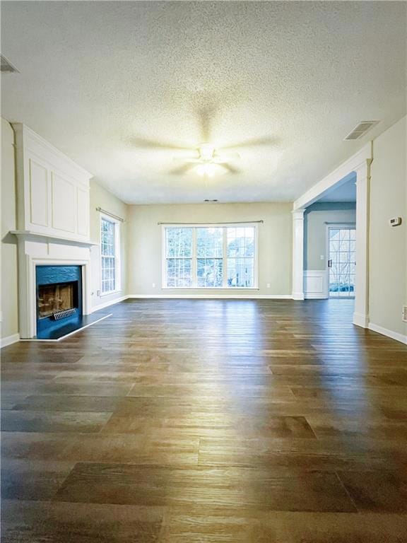 Unfurnished living room featuring visible vents, a