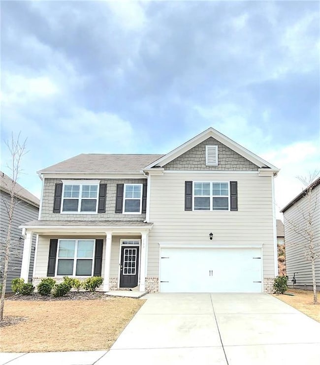 View of front of home featuring a garage
