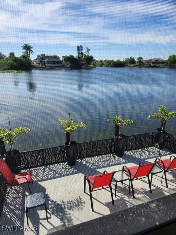 View of patio with a water view