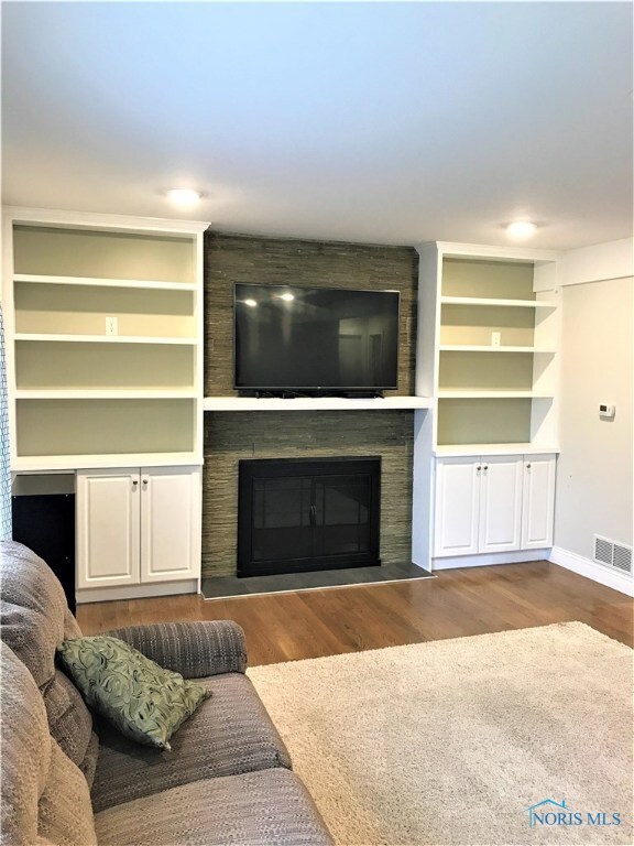 Living room - wood burning fireplace and built-ins