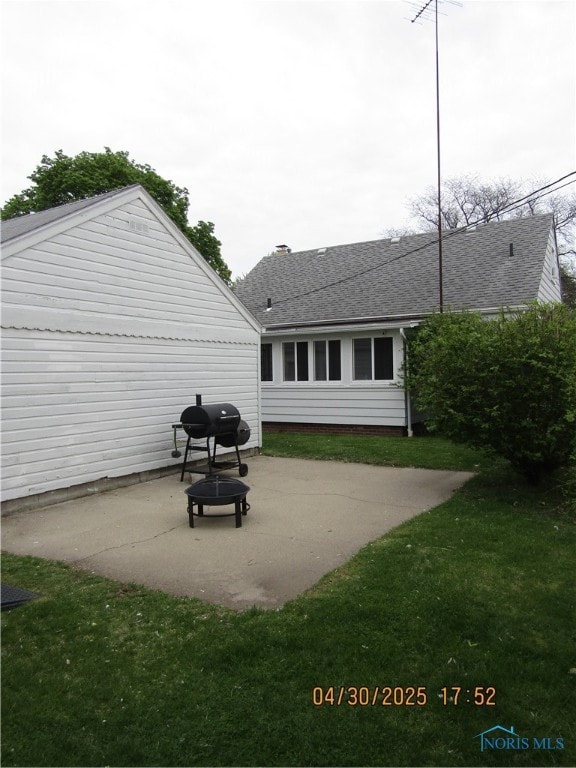 patio area, privacy provided by garage and shed