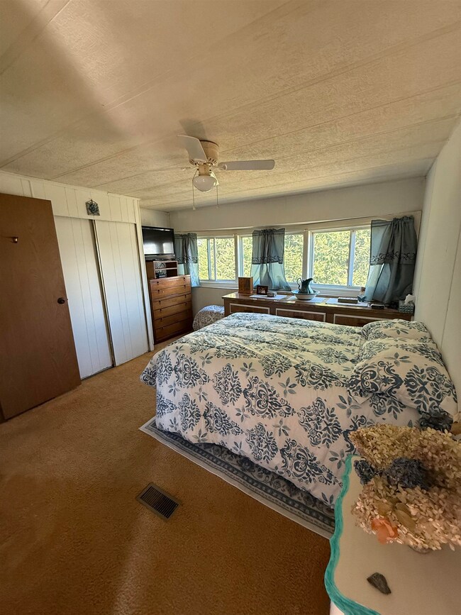 Bright primary bedroom with half bath