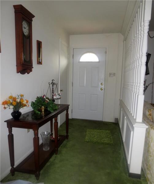 Entry is light & bright, with coat closet, and ope