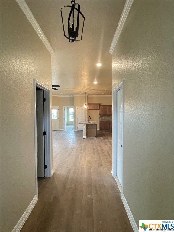Crown molding dresses the elegant foyer that leads