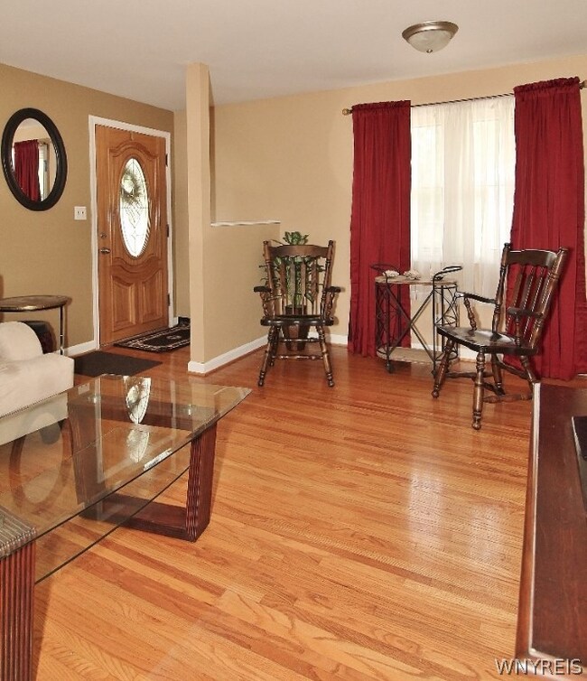 View of dinette area w/ original hardwood floors!