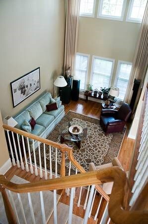 Soaring two story ceilings and banks of windows fo