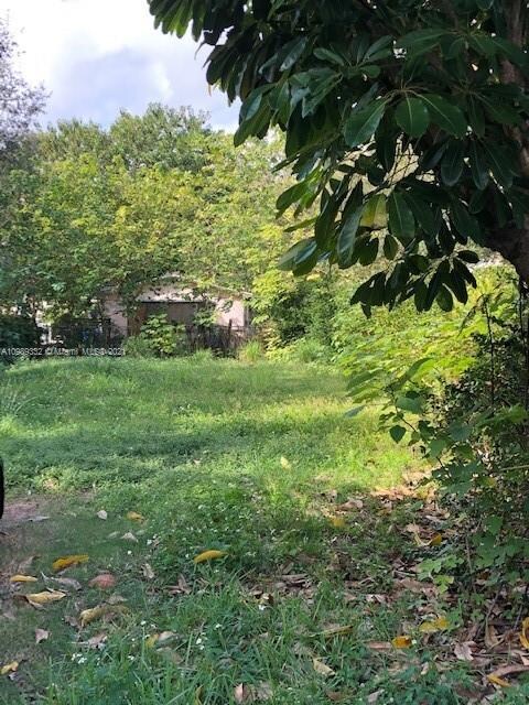 Lot is cleared with paved street access, sidewalks and curbs in place