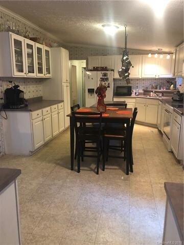 Large kitchen with plenty of  storage and island i