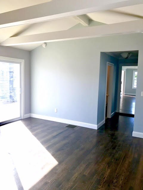 First floor master suite with doors leading to a l