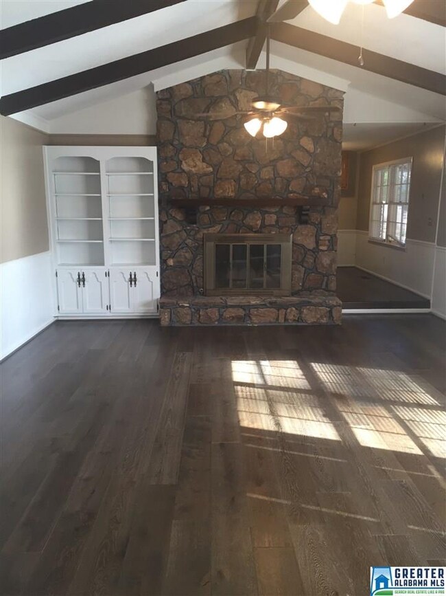 Beautiful spacious living room, hardwood floors, a