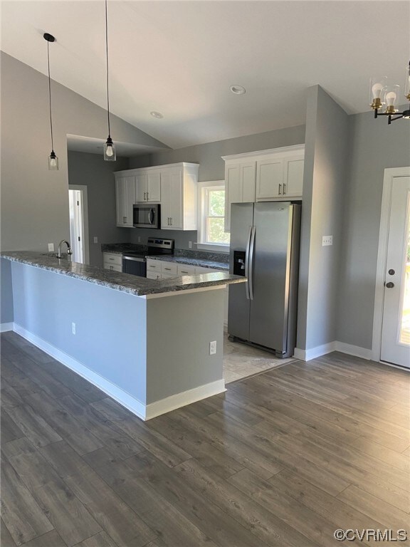 Kitchen featuring appliances with stainless steel