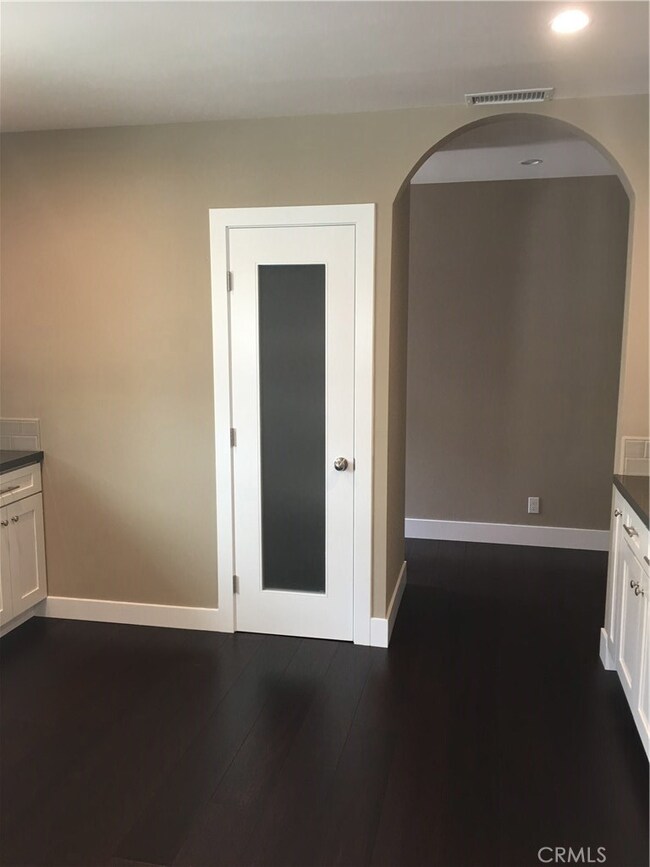 Pantry and entrance to washer and dryer area. As well as access to Master Bedroom and Side door exit to backyard.