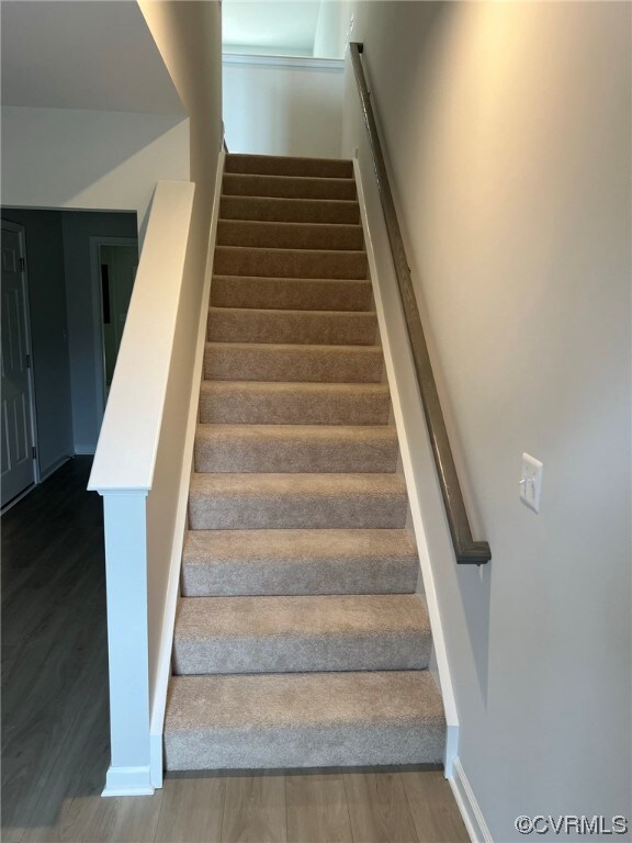 Stairs with dark hardwood floors