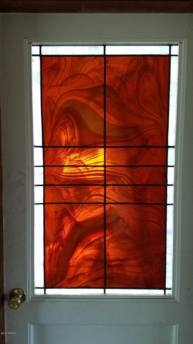 Stained glass accent in door.