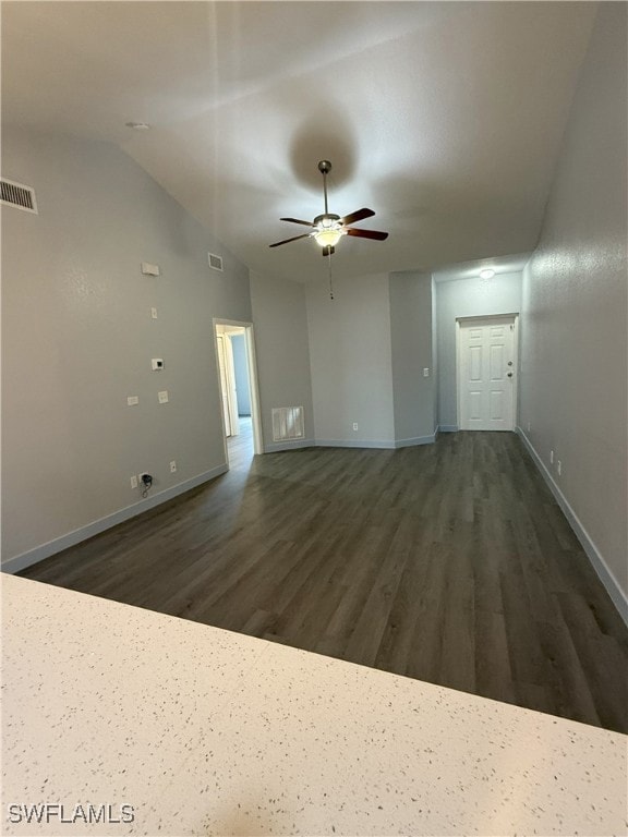 Empty room with wood finished floors, ceiling fan,